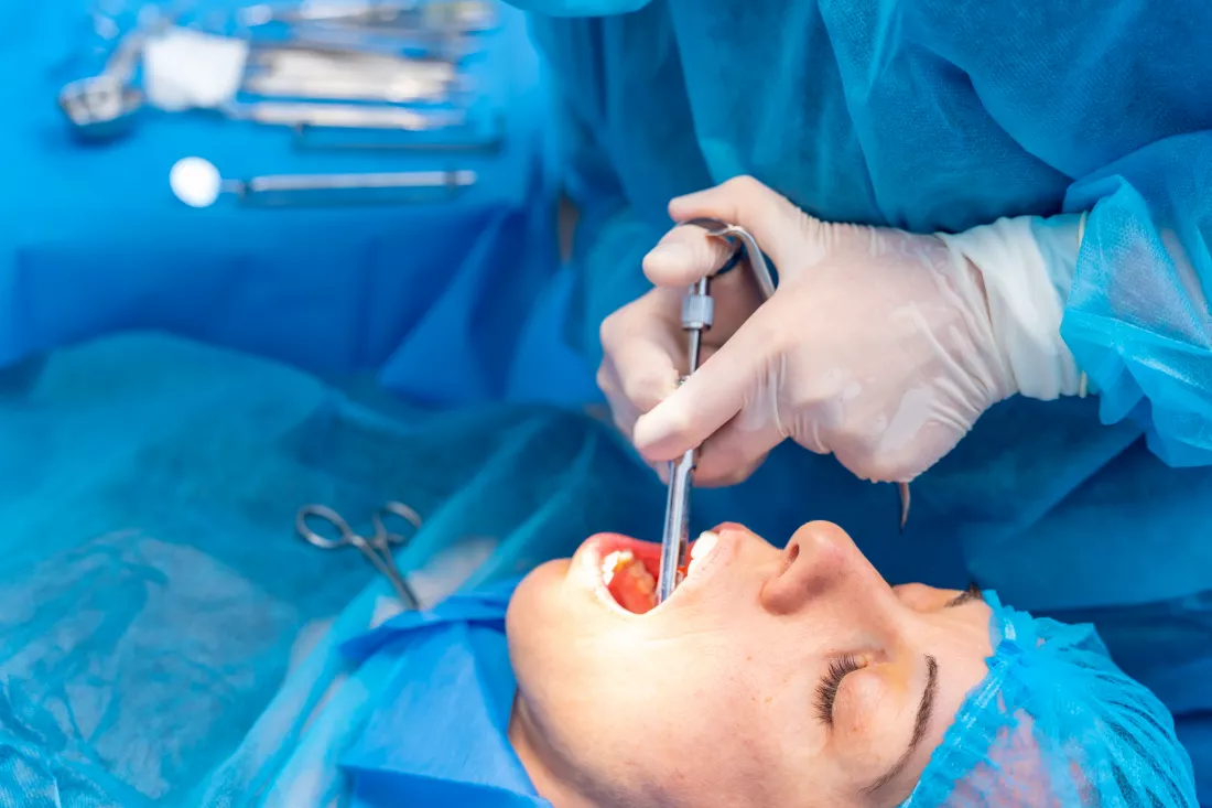dental-clinic-female-dentist-doctor-applying-anesthesia-injection-before-operation
